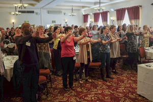 Conference attendees doing  "A-tooty-ta"
